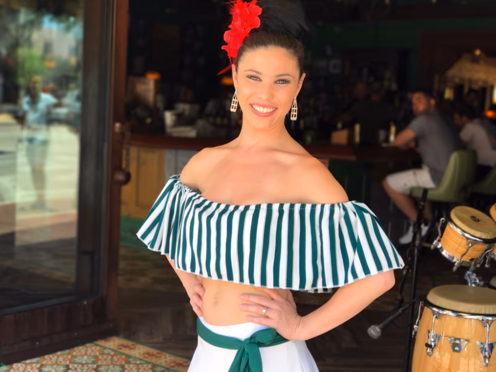 Beautiful flamenco dancer dressed in a Cuban-themed costume performing in Little Havana