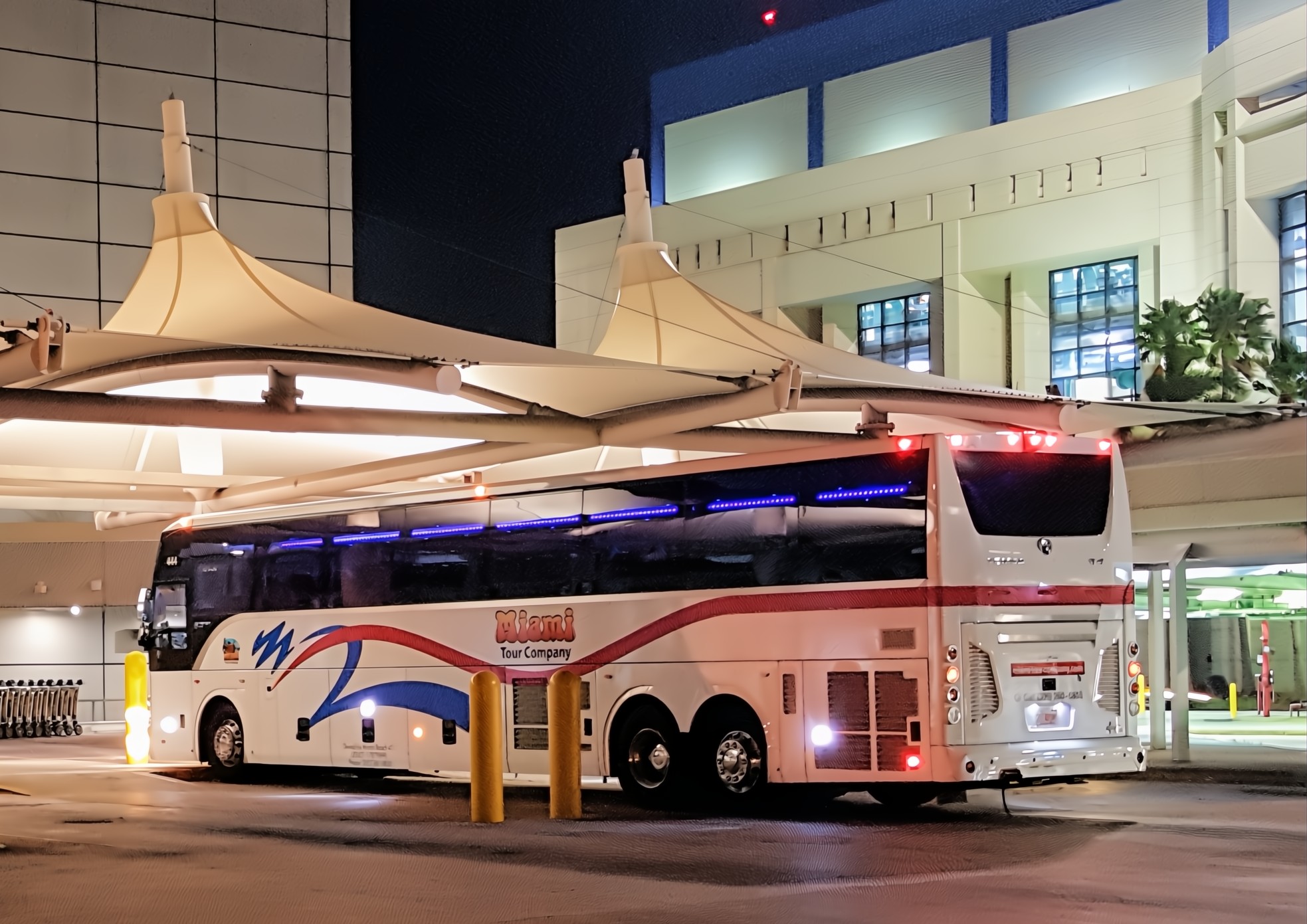 Motorcoach bus parked at Miami Airport at night