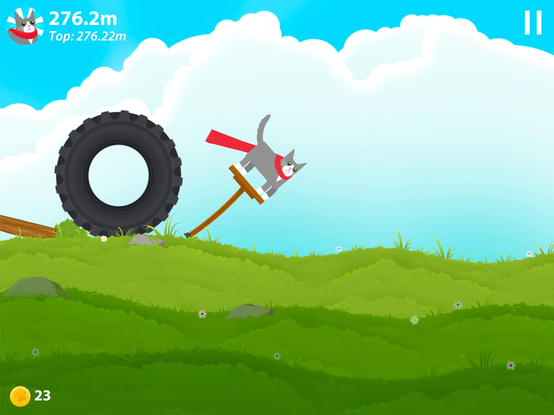 A screenshot from Pogocat. A cat on a pogostick is being chased across a meadow by a runaway tractor tyre.