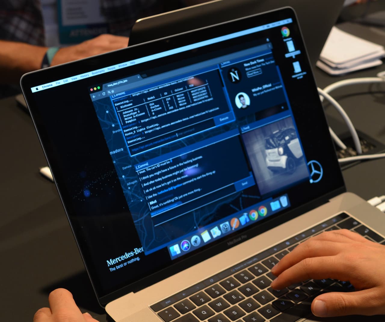 A laptop screen showing the interface of the application. It is a hacker-like interface where players interact with a command console to hack into a car.