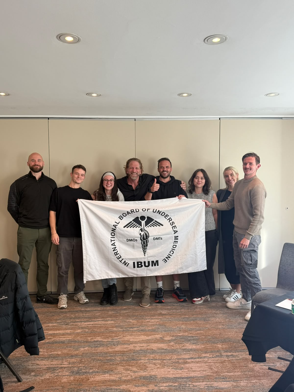 The Breathe team with the IBUM flag on completing certification