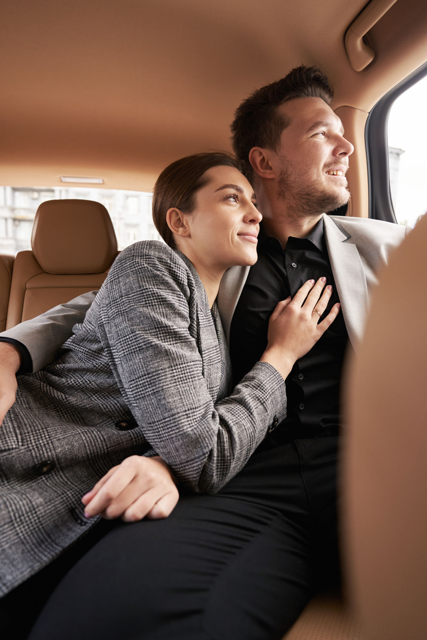Business travellers in the back of a transfer vehicle