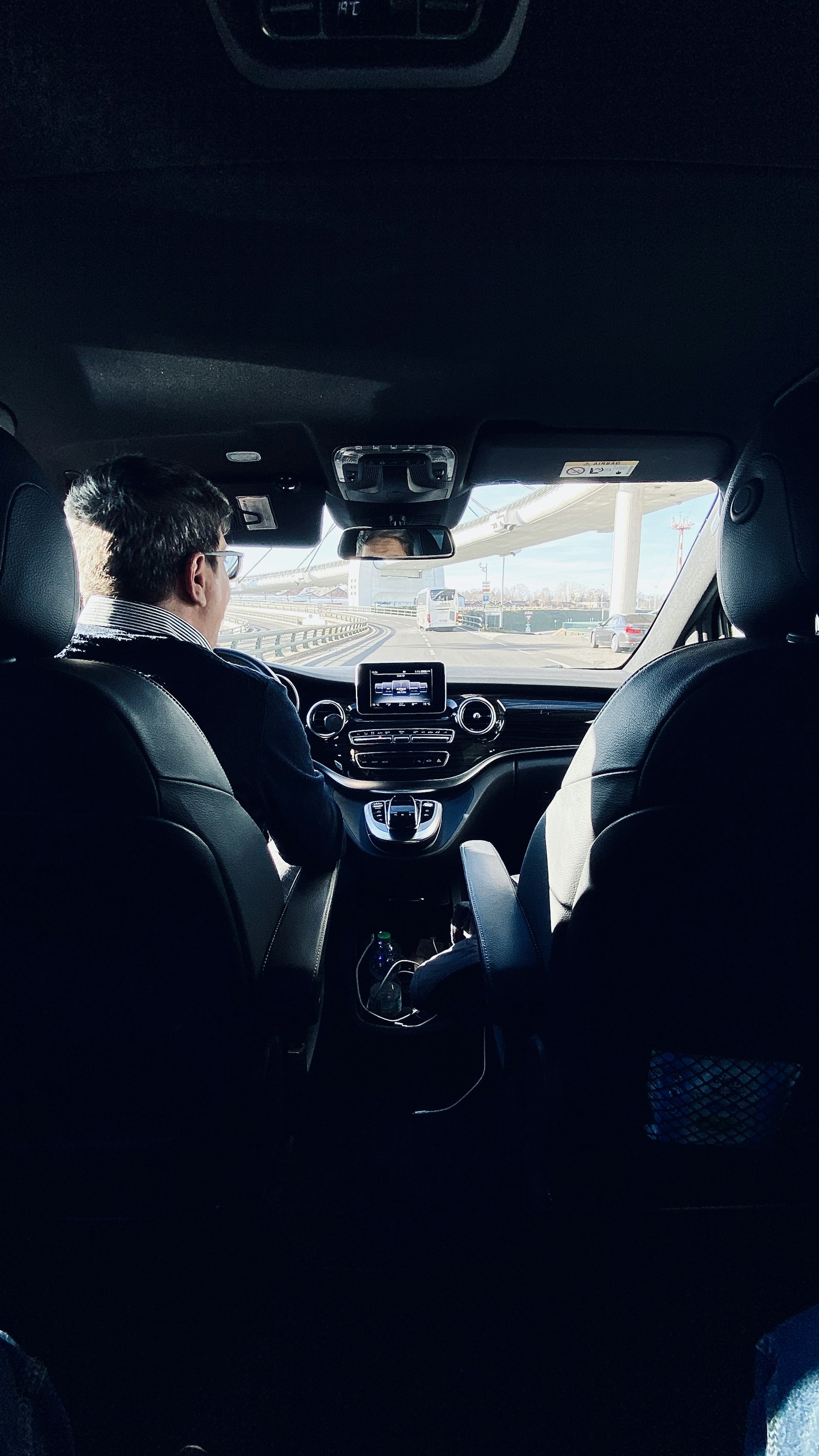 Chauffeur driving a passenger from the airport