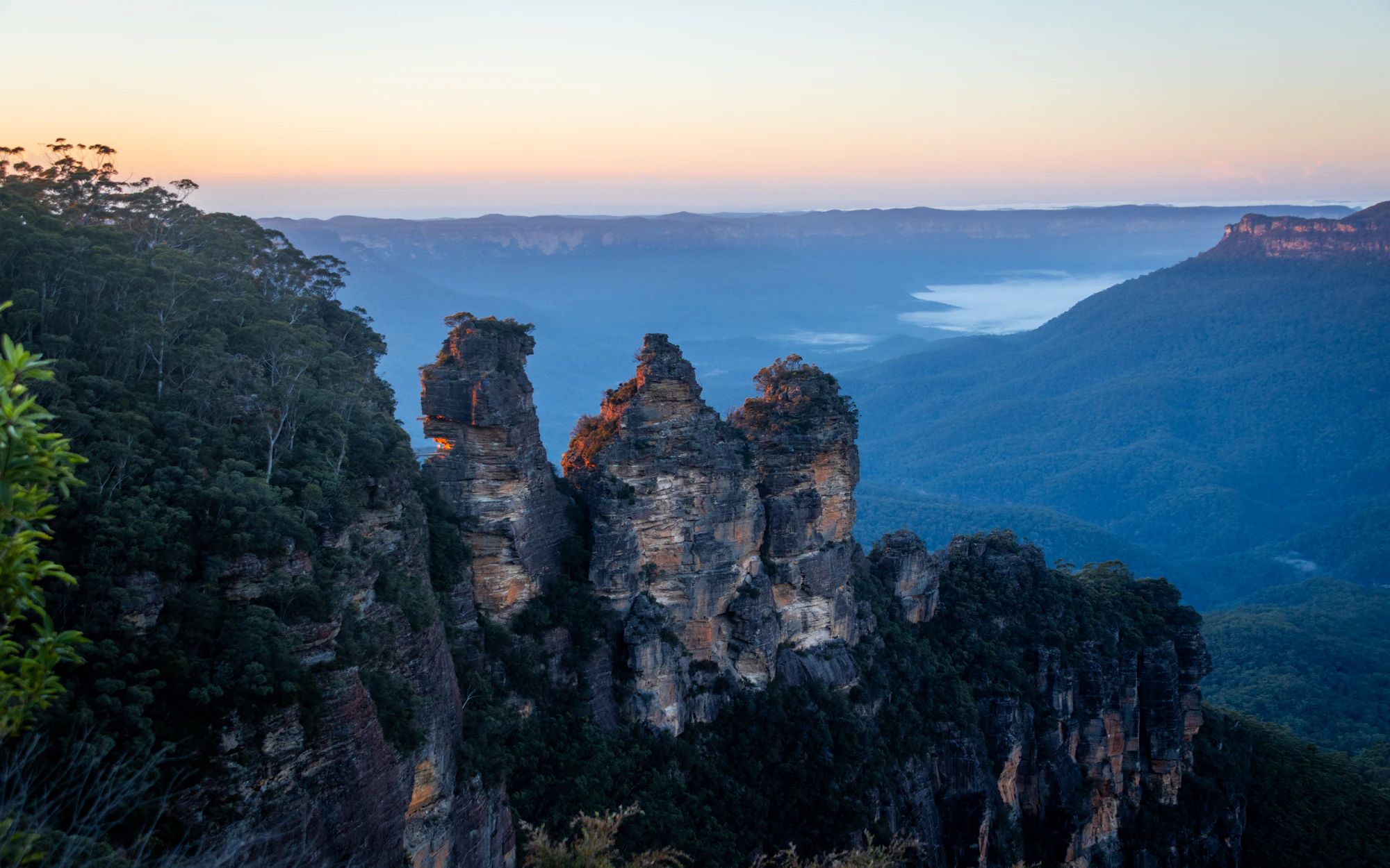 The Three Sisters rock formation in the Blue Mountains at dusk