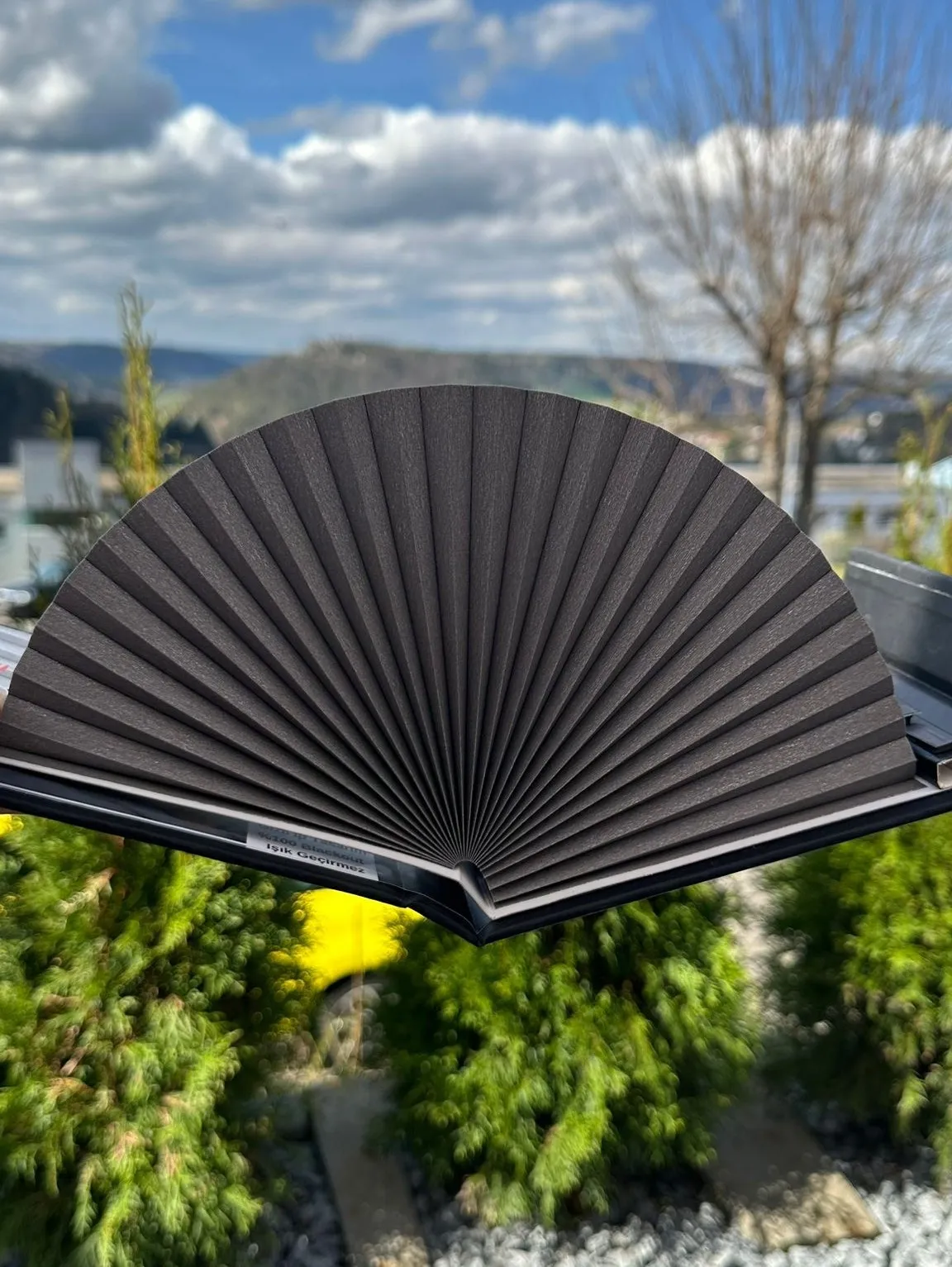 Close-up shots of various outdoor sun protection fabrics and systems