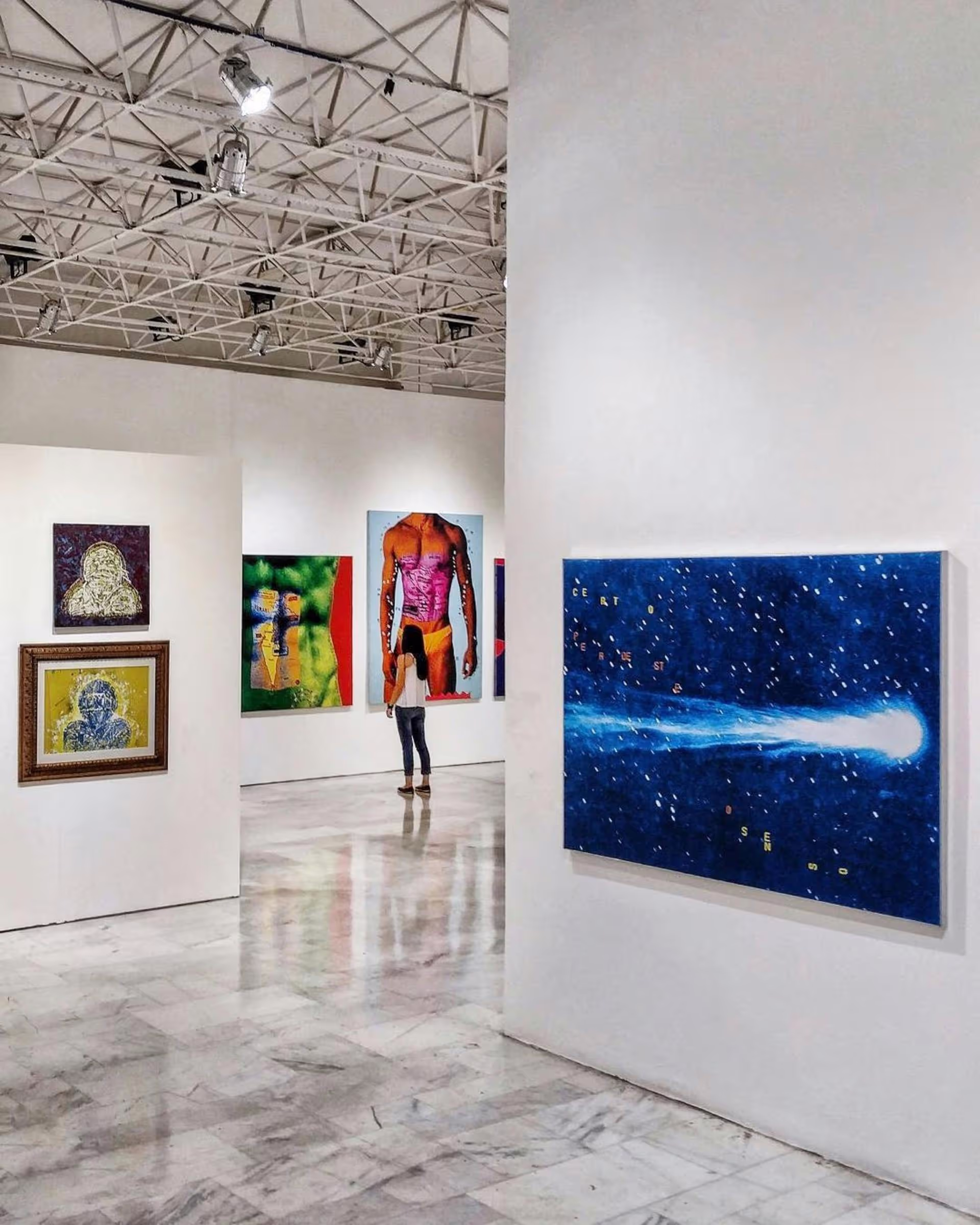 A contemporary art gallery with colorful paintings