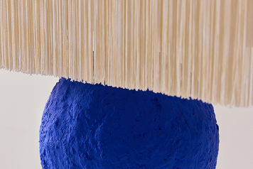 Tall Stack Lamp, 2025, sculptural lighting, cement, lacquer, fringe, UL-listed lighting components.