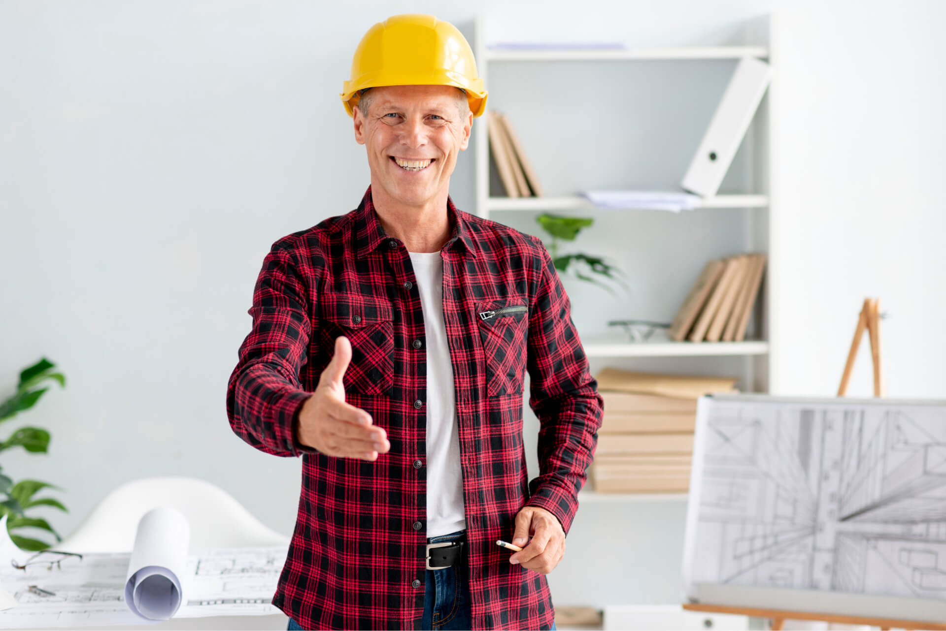 The photo shows a builder smiling pleasantly