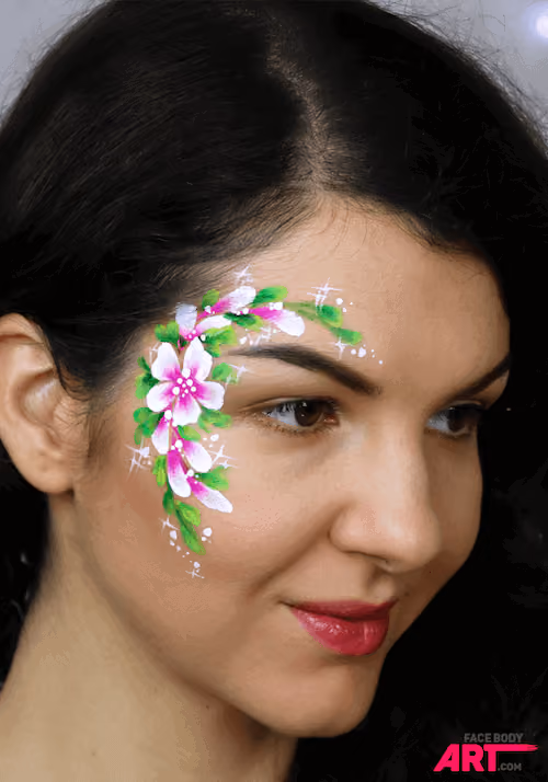 a woman with a double dip flower face painting design around her eye