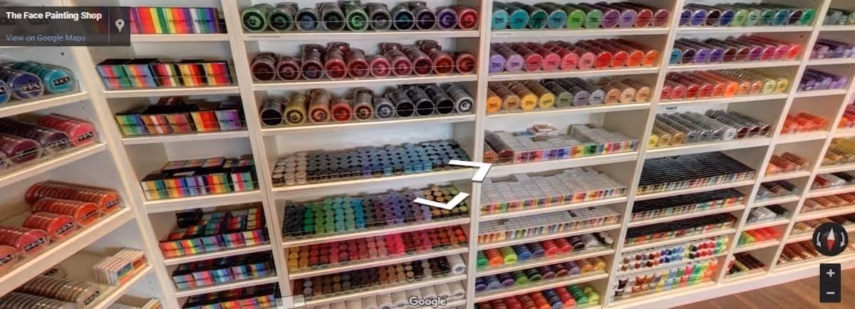 colorful face paint stacked on a shelf