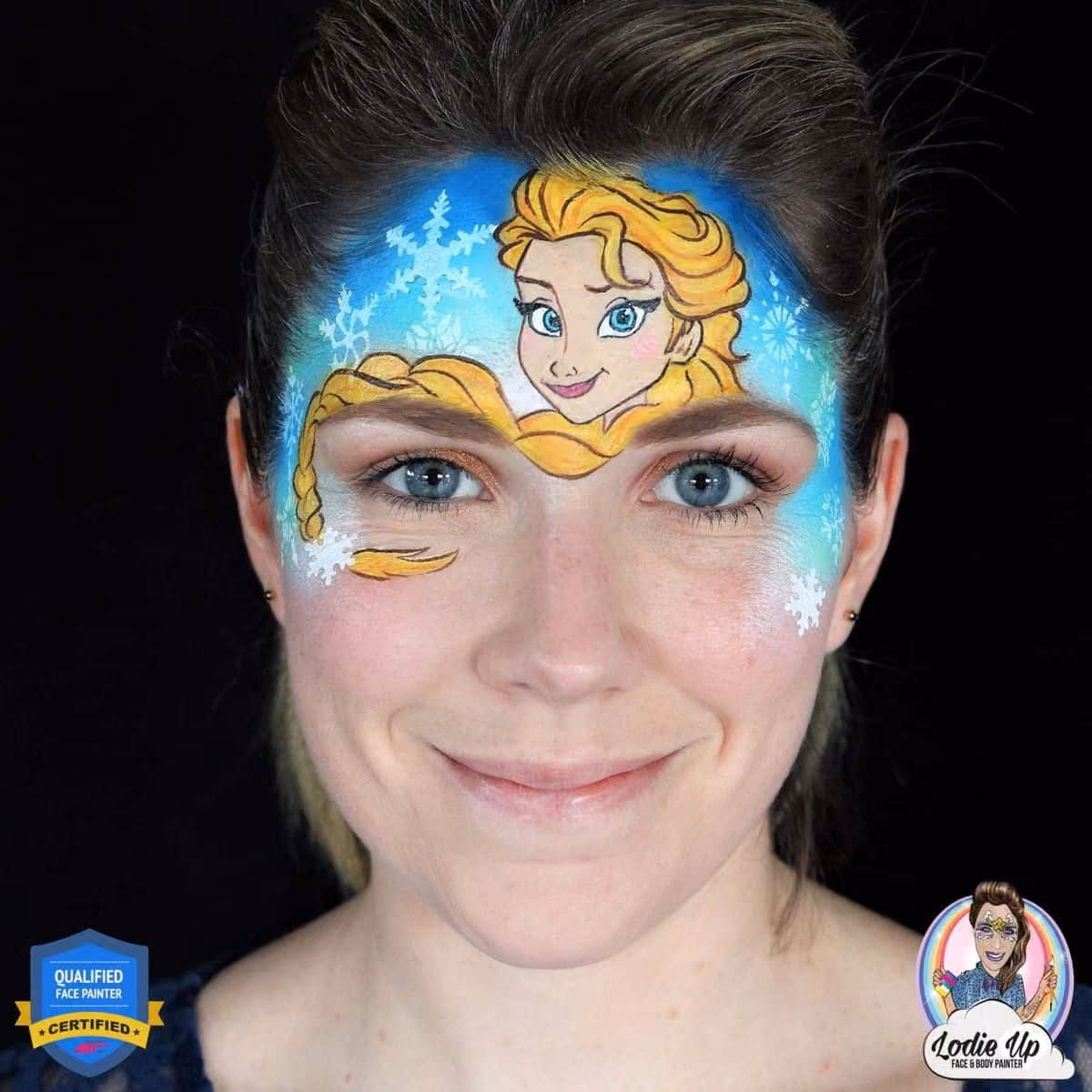 a woman with a compleated elsa face paint design on her forehead