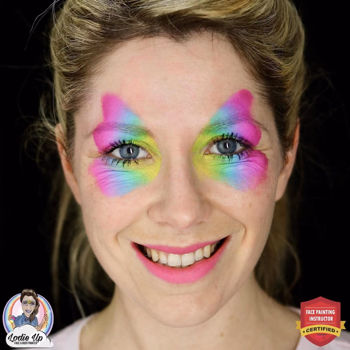a woman with gradient butterfly wings painted on her eyes