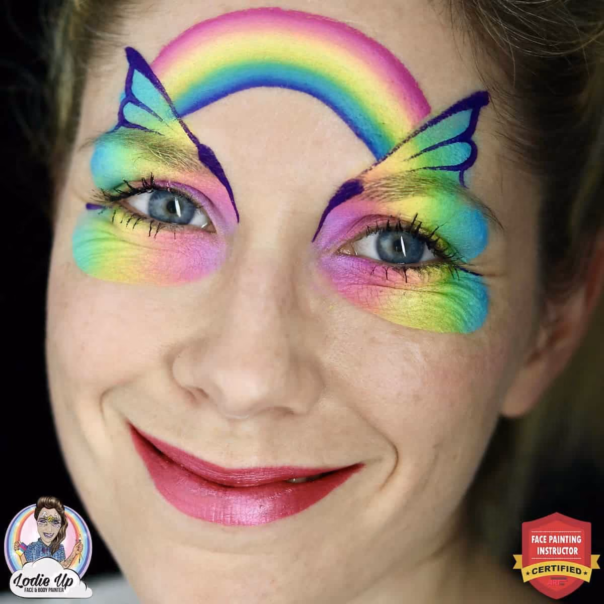 a woman with rainbow butterfly wing on her eyes connected by a rainbow on her forehead