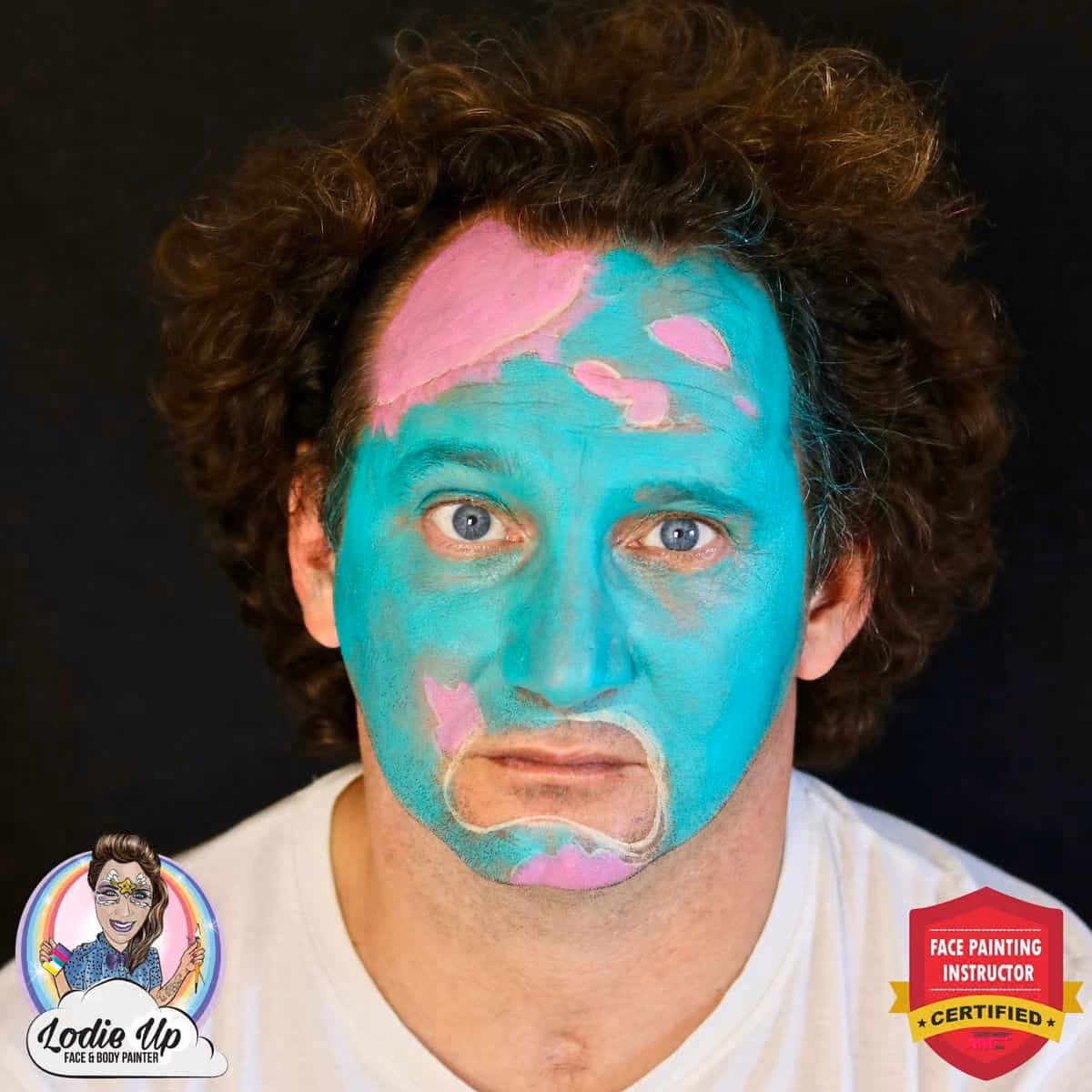 man looking at the camera with colors added to the outline of his zombie face paint