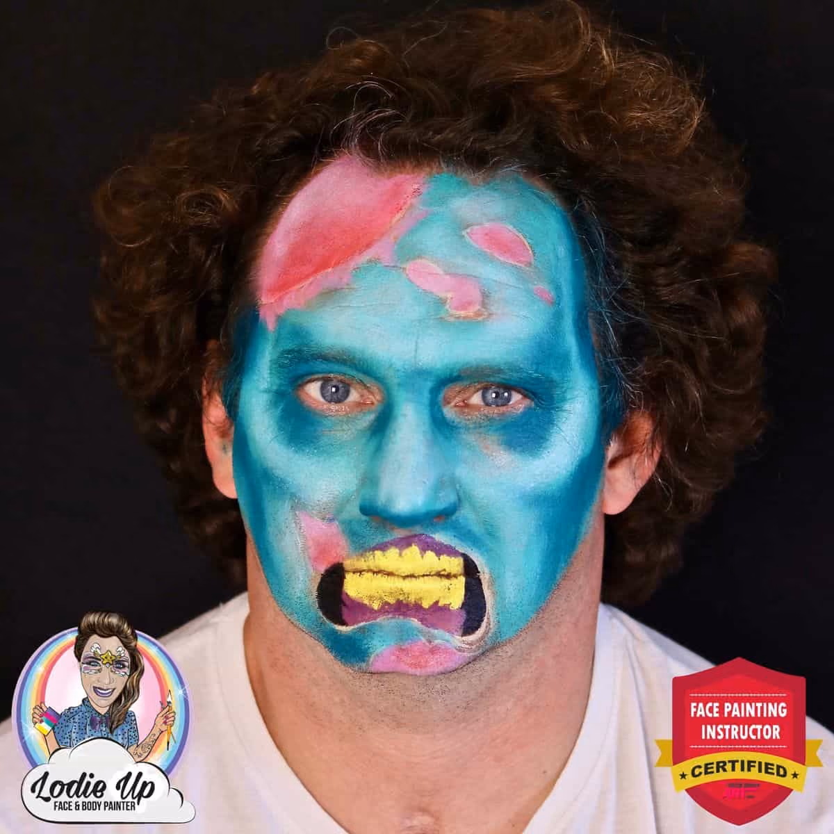 man with a zombie face paint but now with added yellow teeth to the design