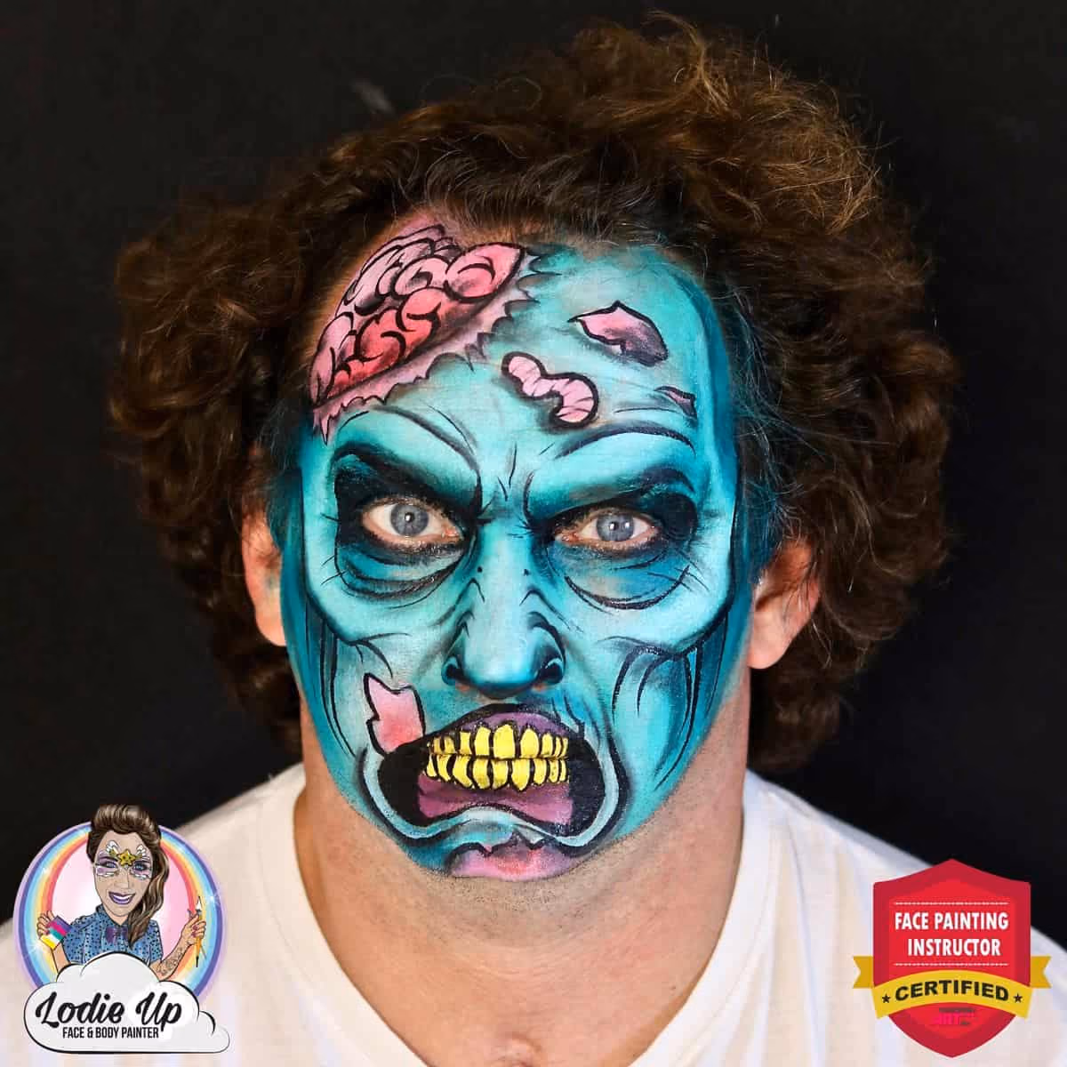 a man looking at the camera with a bright and spooky zombie face paint design