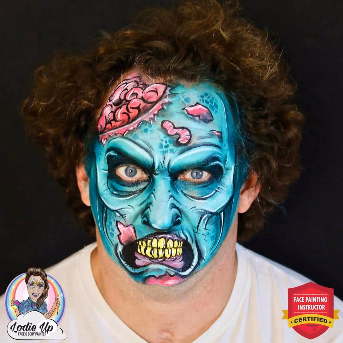 a man looking at the camera with a finished design of a zombie face paint