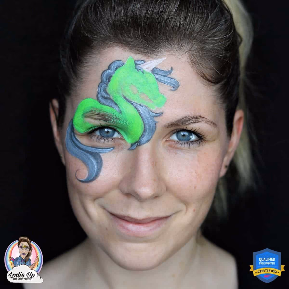 a woman with a undetailed zombie unicorn face paint design