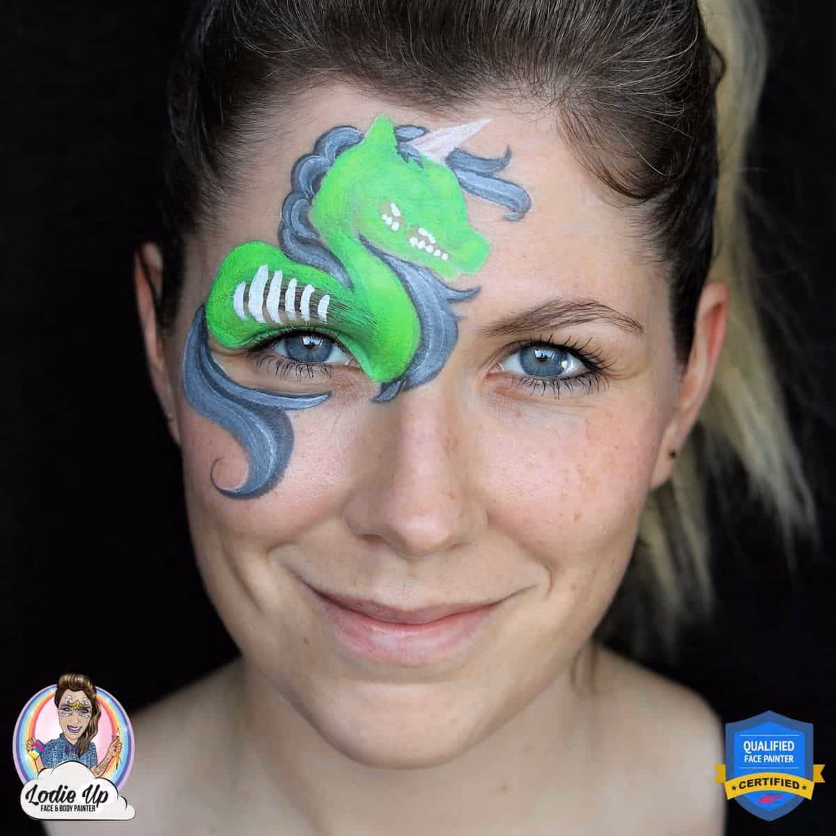 a woman with a undetailed zombie unicorn face paint design with visable ribs and teeth