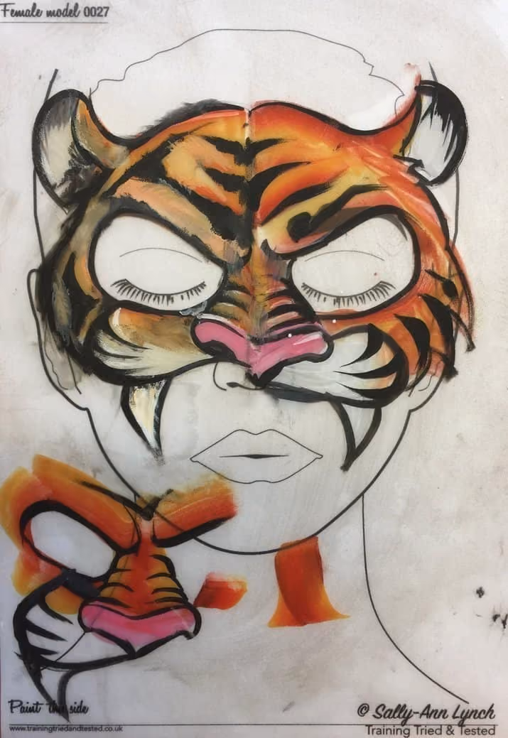 an practice sheet with a tiger face paint design painted on it