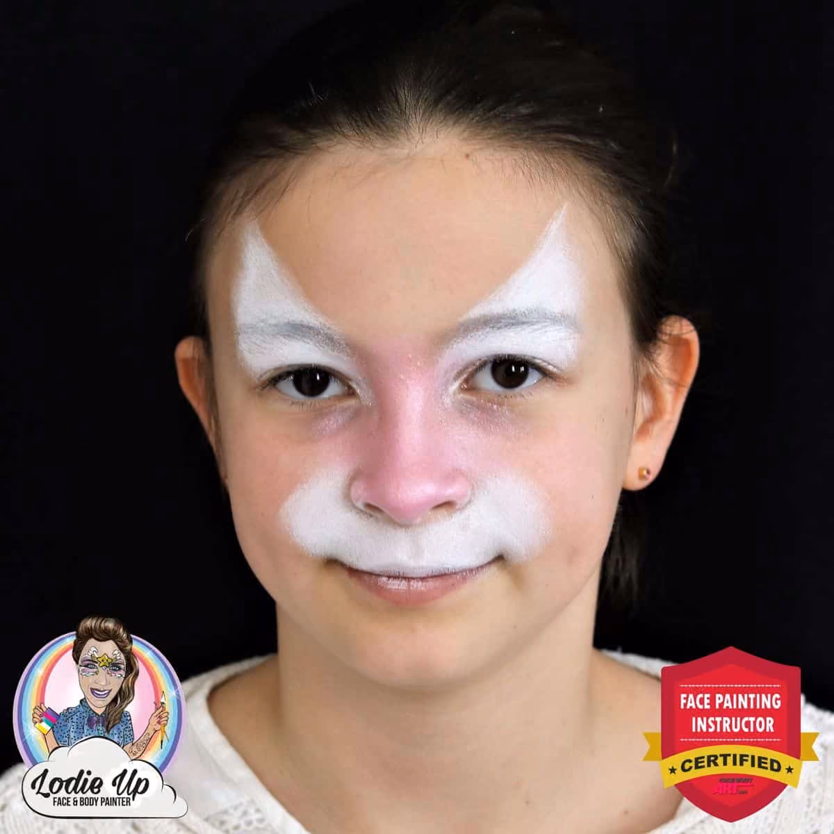 a girl with a white and pink base of a colorful tiger face paint design on her face