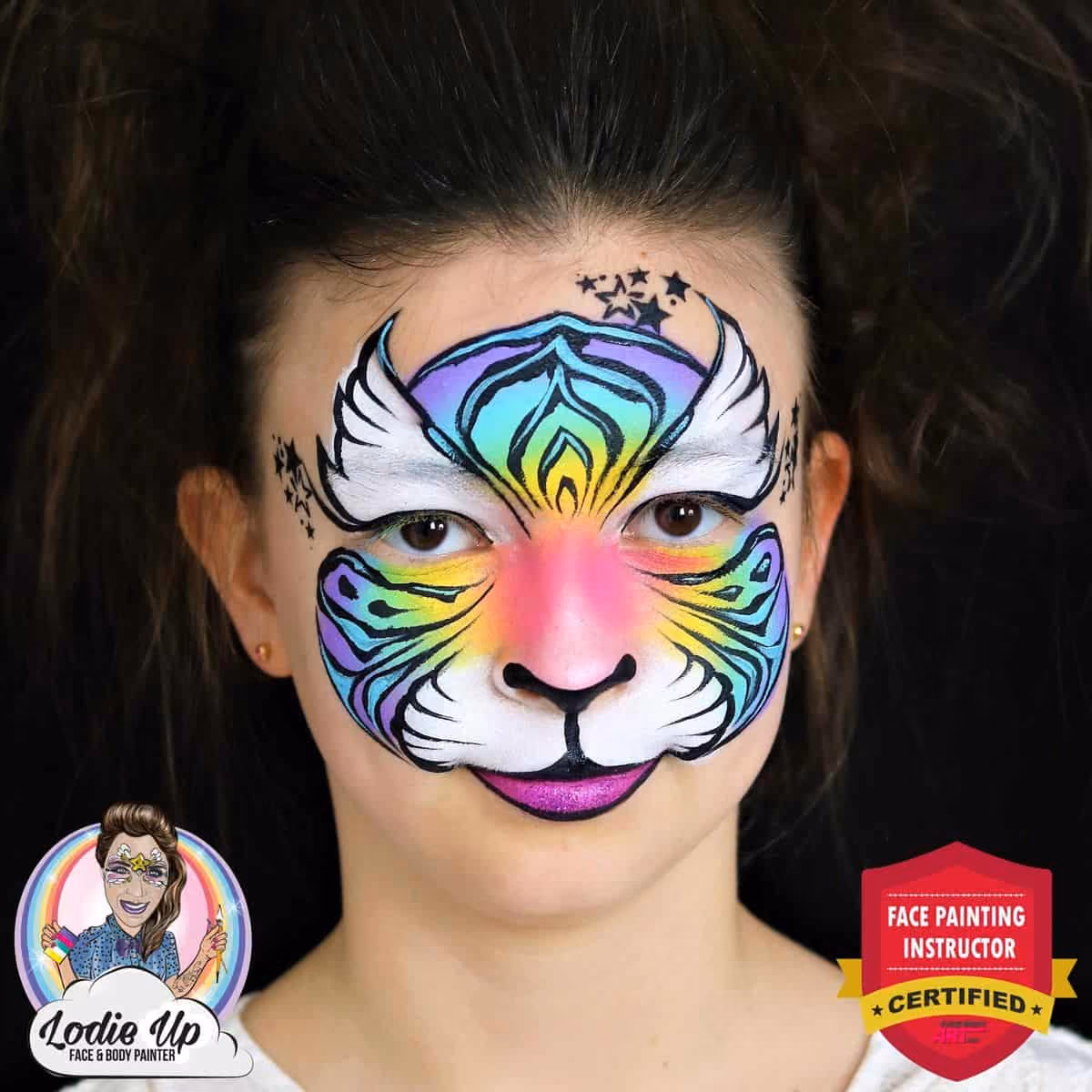 a girl with a compleated design of a colorful tiger face paint