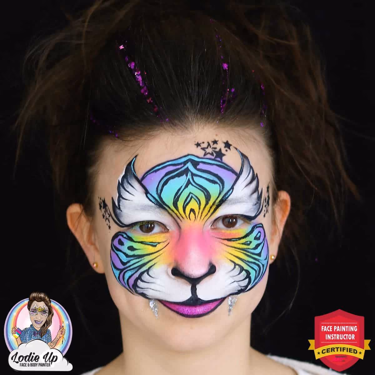 a girl with a compleated vibrant and colorful tiger face paint design