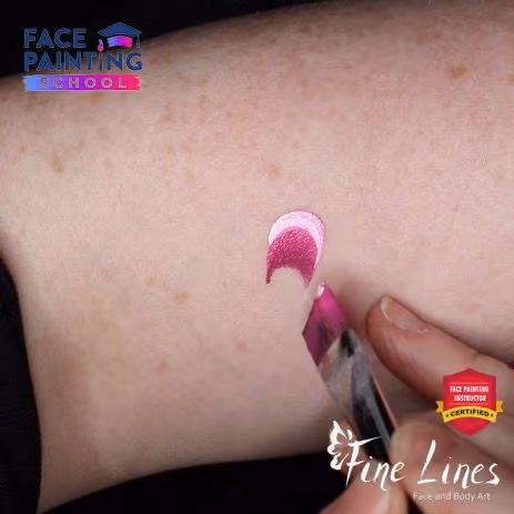 white and pink stroke of the brush on a arm