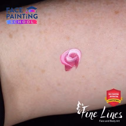 miniature minimalistic rose done in three strokes of a face painting brush