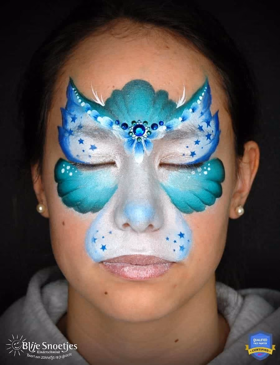 a girl with a slightly more detailed kitty face paint