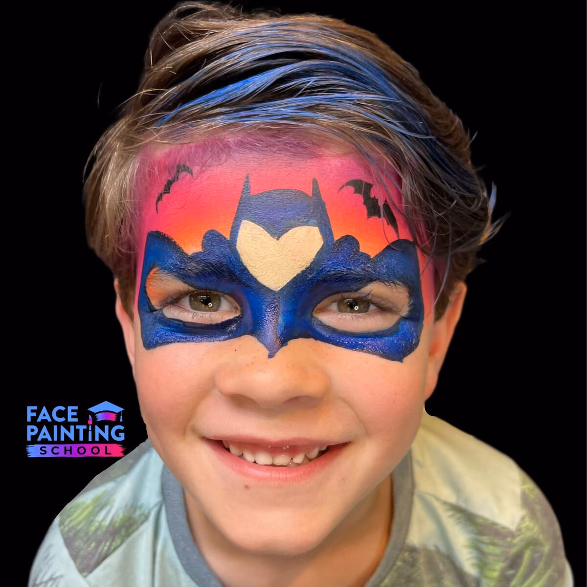 a boy looking at the camera with a compleated an uncomplete batman mask face paint
