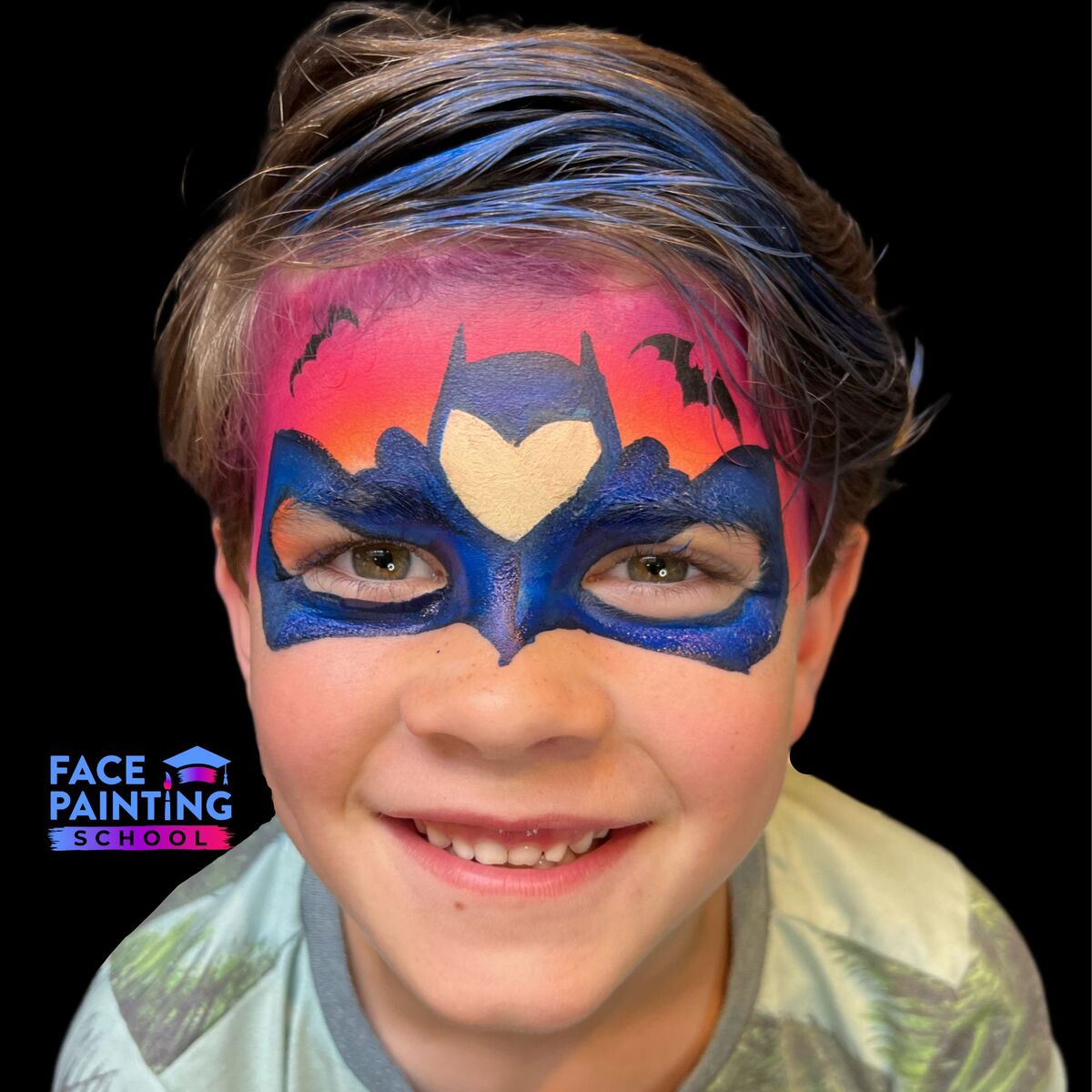 a boy looking at the camera with a compleated an uncomplete batman mask face paint