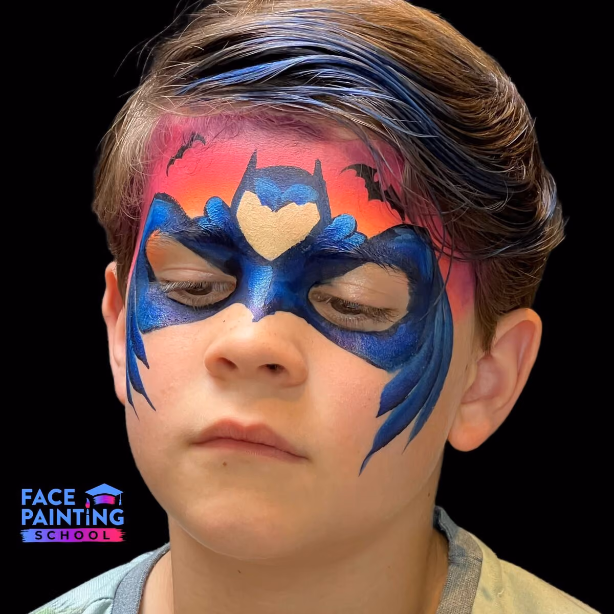 boy with a batman mask face paint over his face