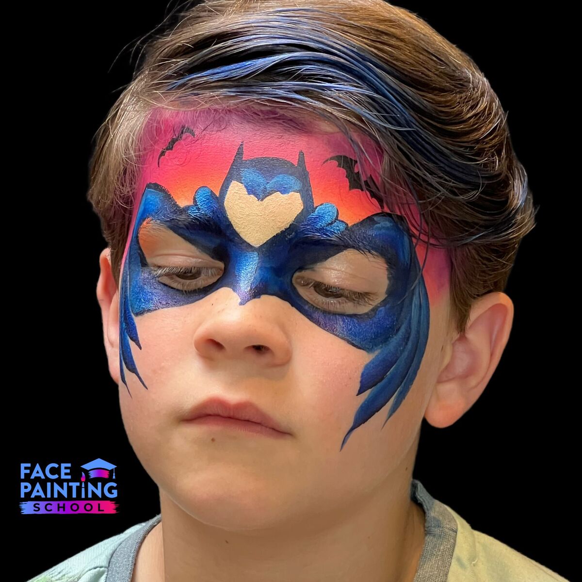 boy with a batman mask face paint over his face