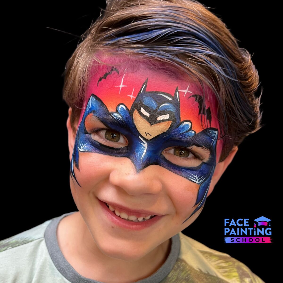 a boy looking at the camera with a compleated batman mask face paint