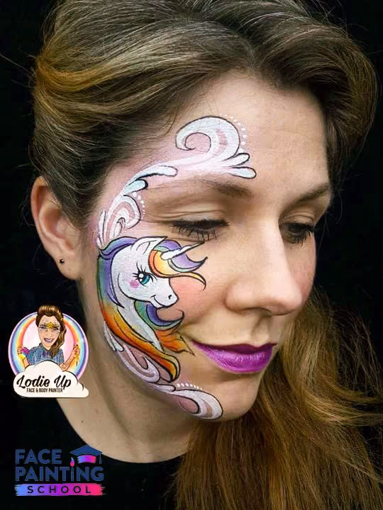 a woman with a completed magical unicorn face paint design