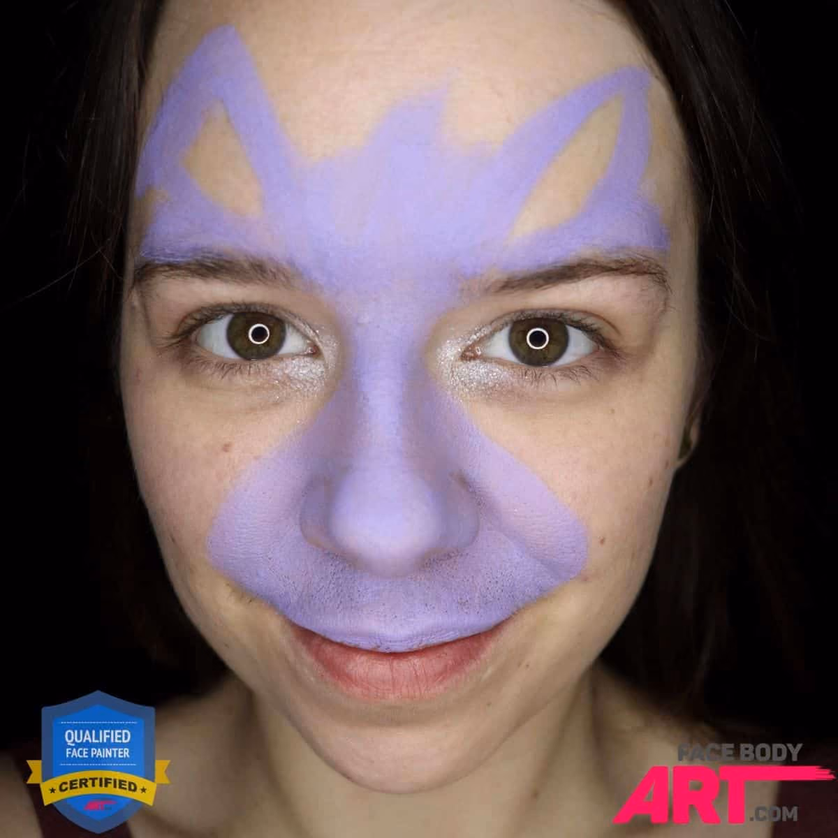 a girl with a base of a bunny face paint on her