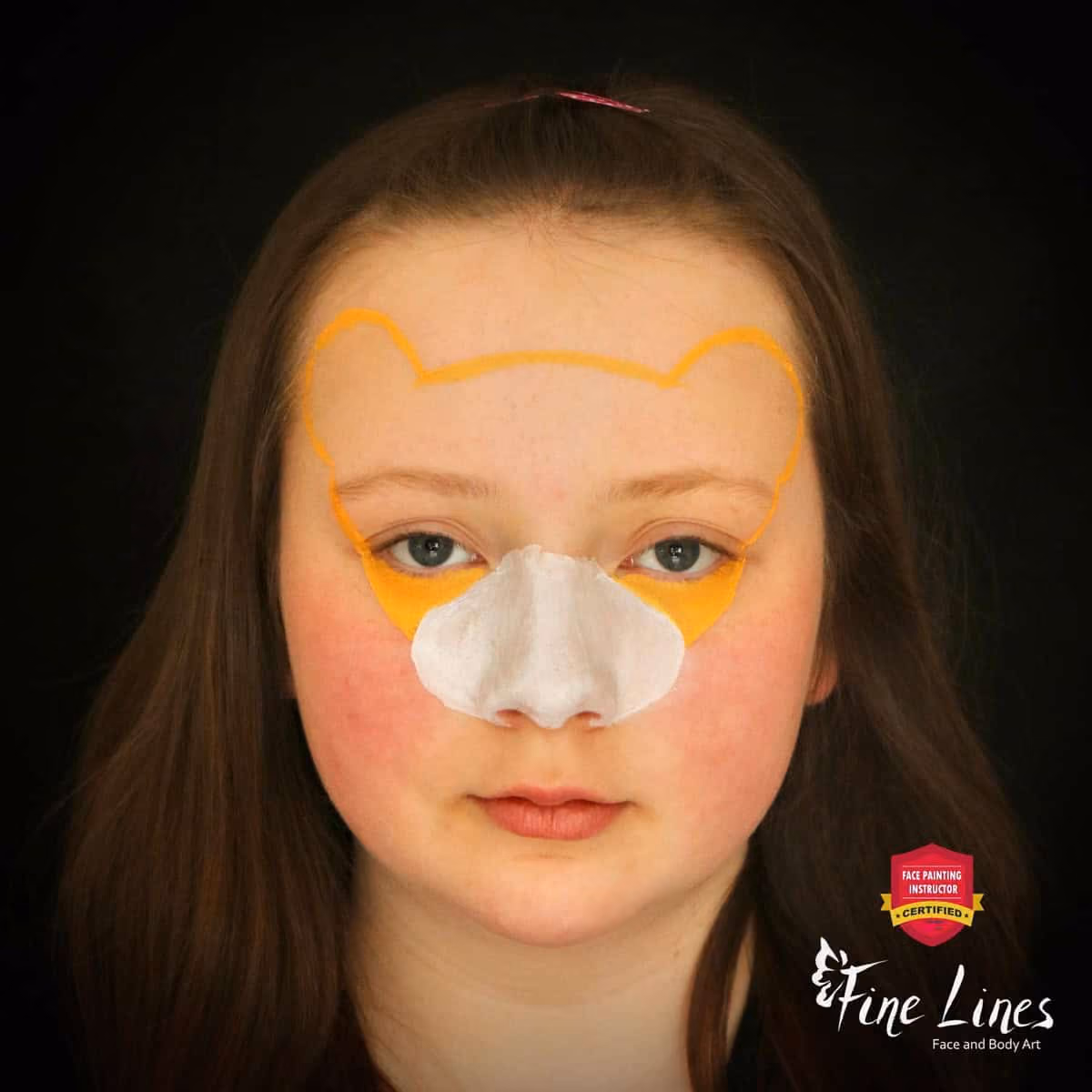 a girl with an outline of a lion face paint design