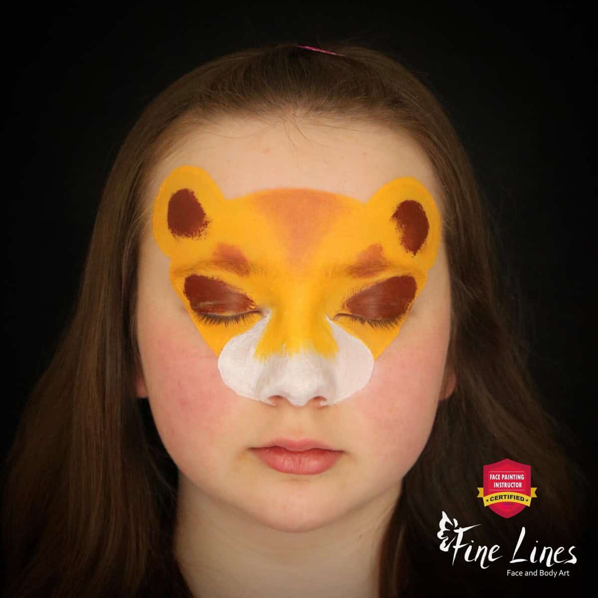 a girl with a base of a lion face paint design on her face
