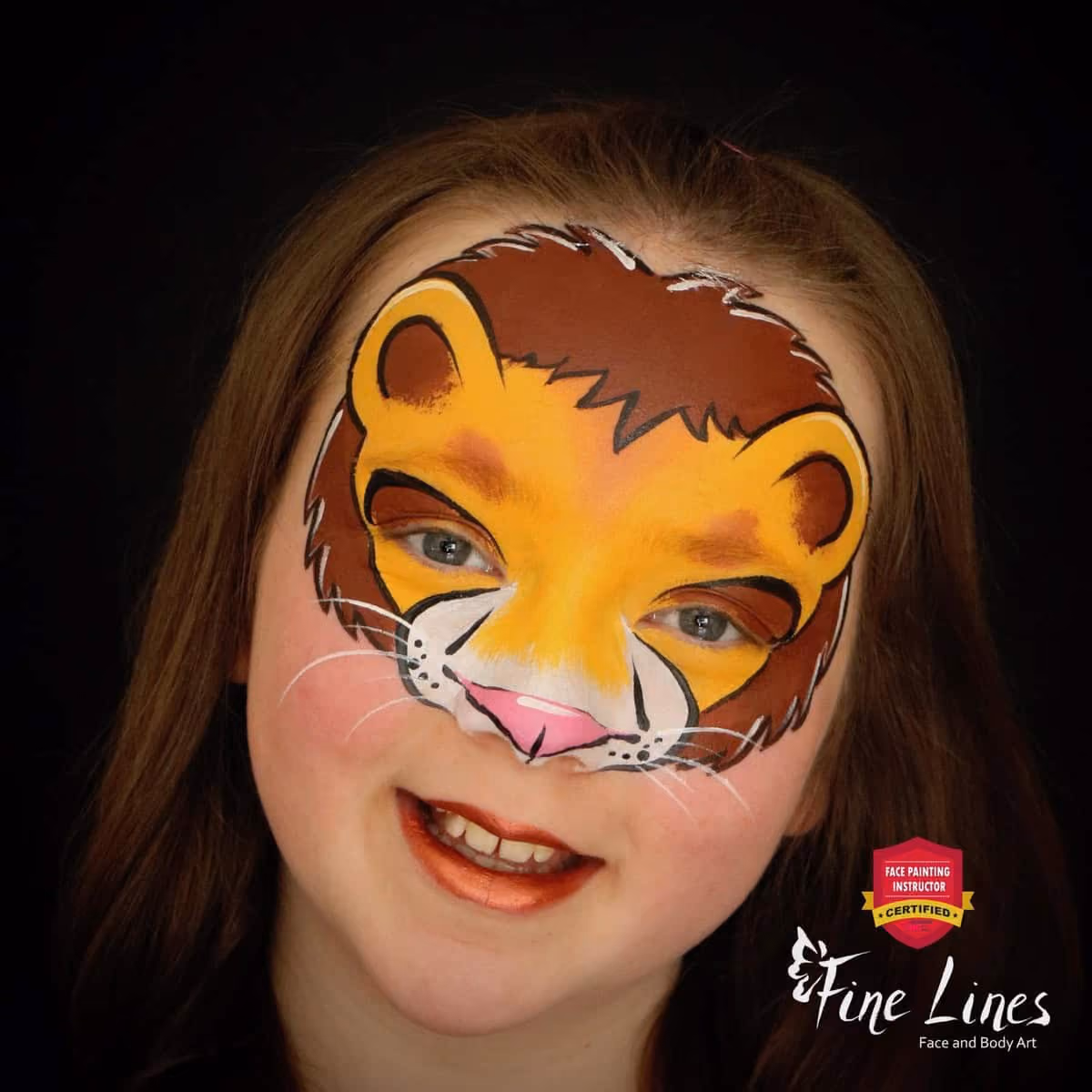 a girl with a compleated lion face paint design