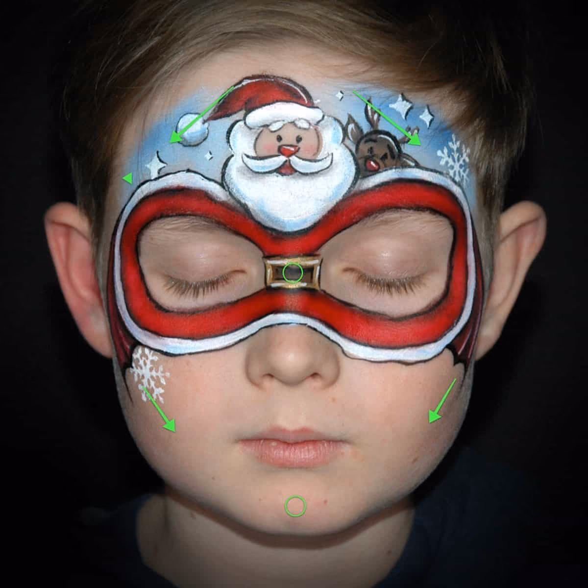 a boy with a christmas santa clause around his closed eyes