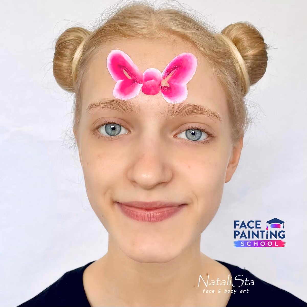 a girl with a detailed pink bow painted on her face