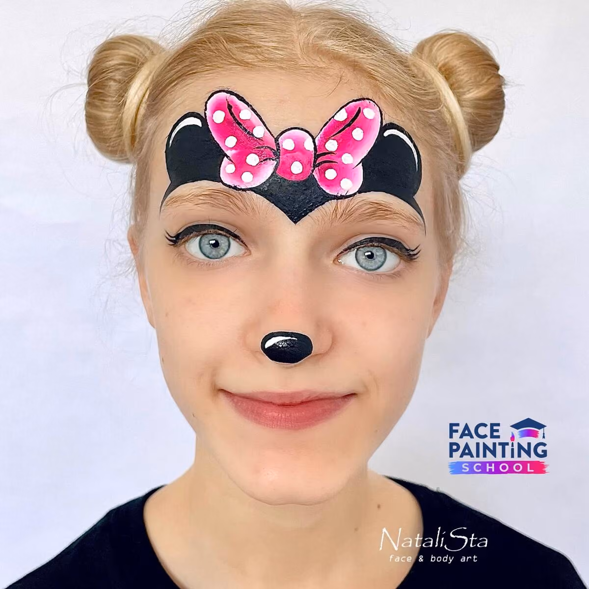 a girl with a compleated minnie mouse face paint design