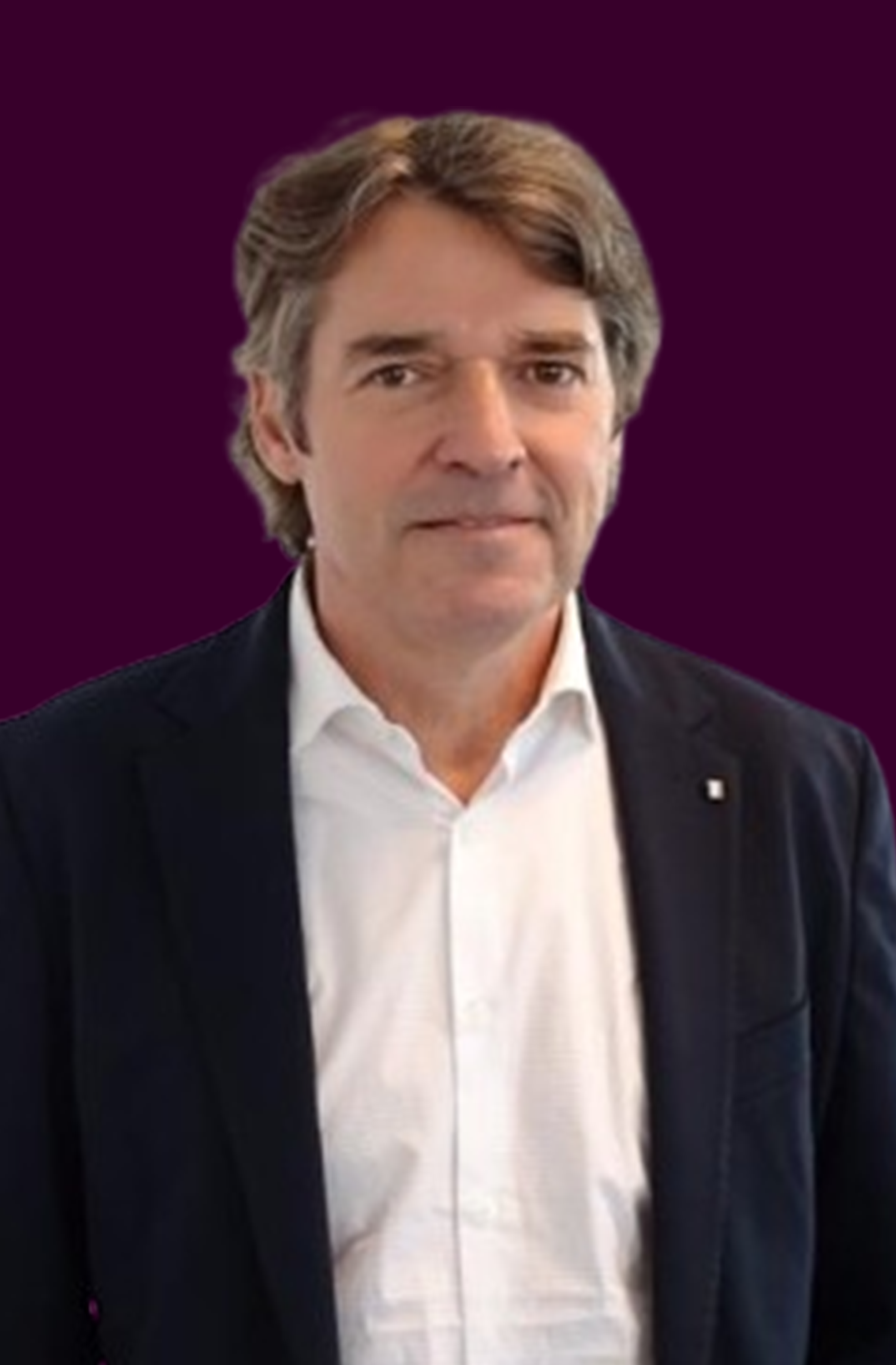 Frista's CEO wearing a white shirt and dark blazer against a dark purple background.