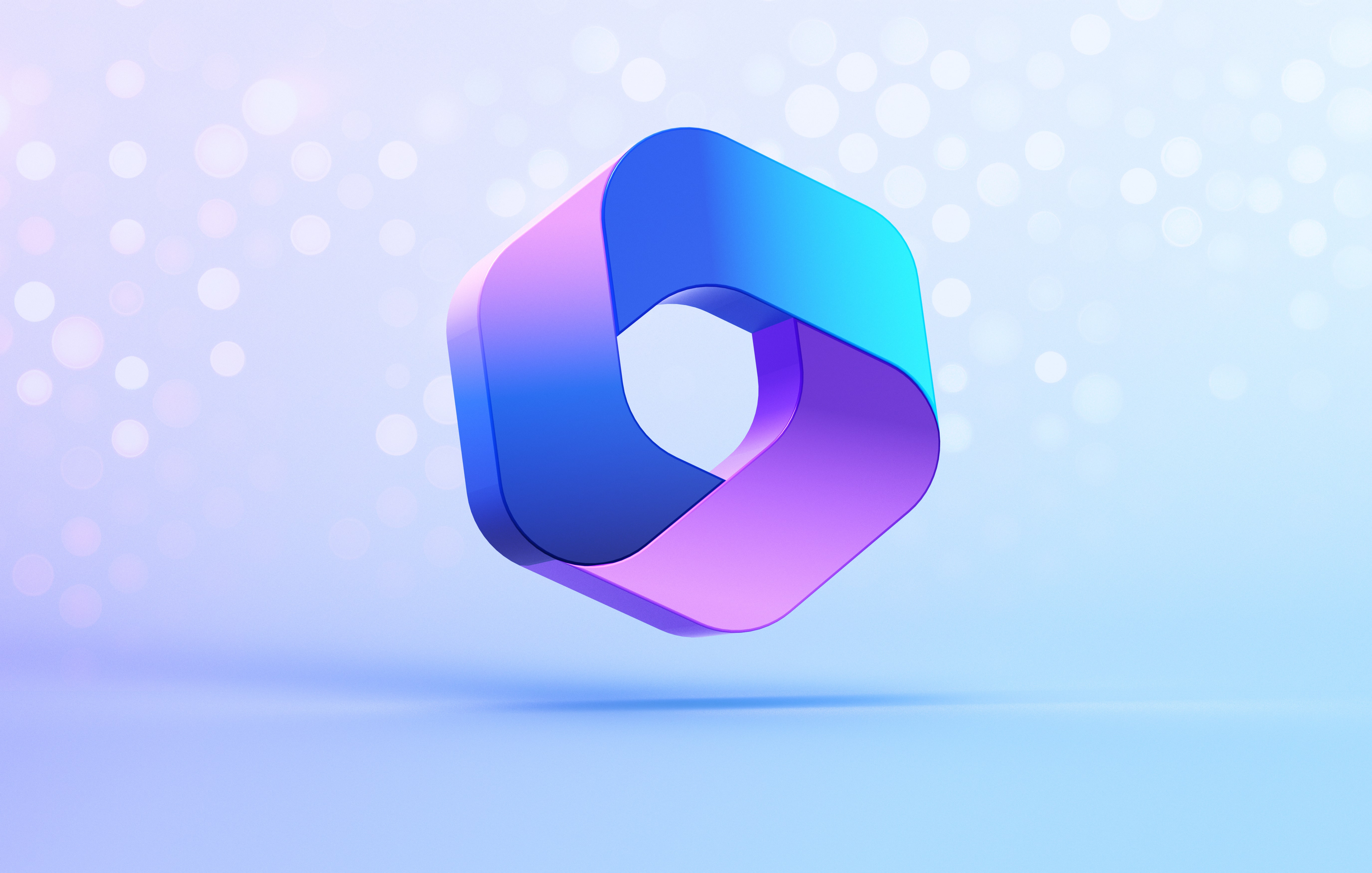 3D geometric shape with rounded corners in blue and purple hues floating against a light blue bokeh background.