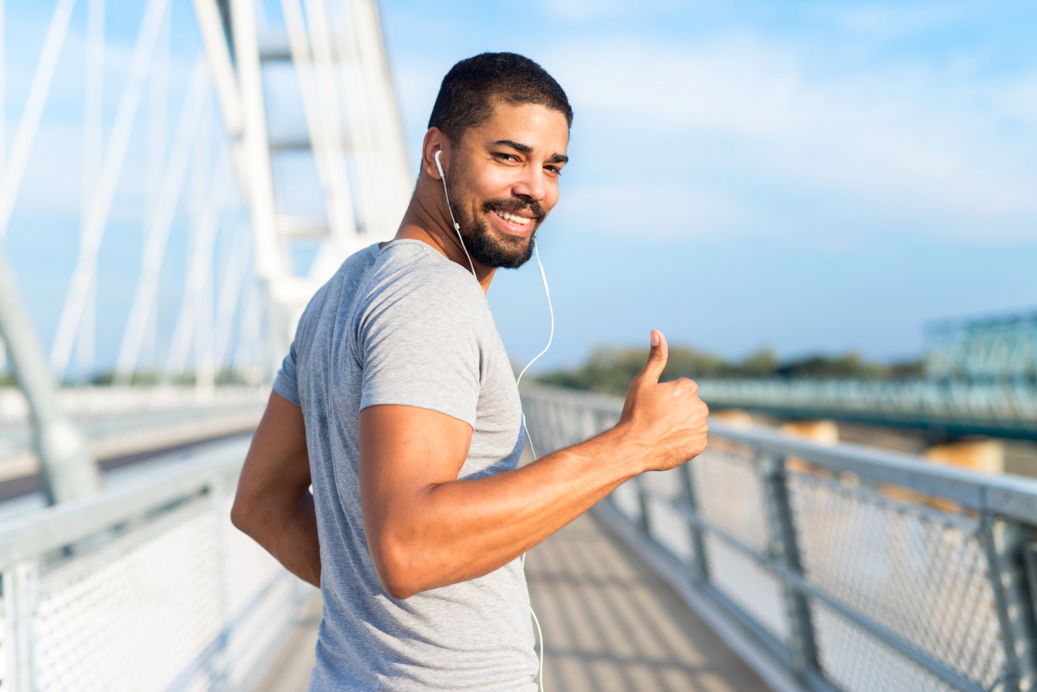 A happy man showing a thumbs up