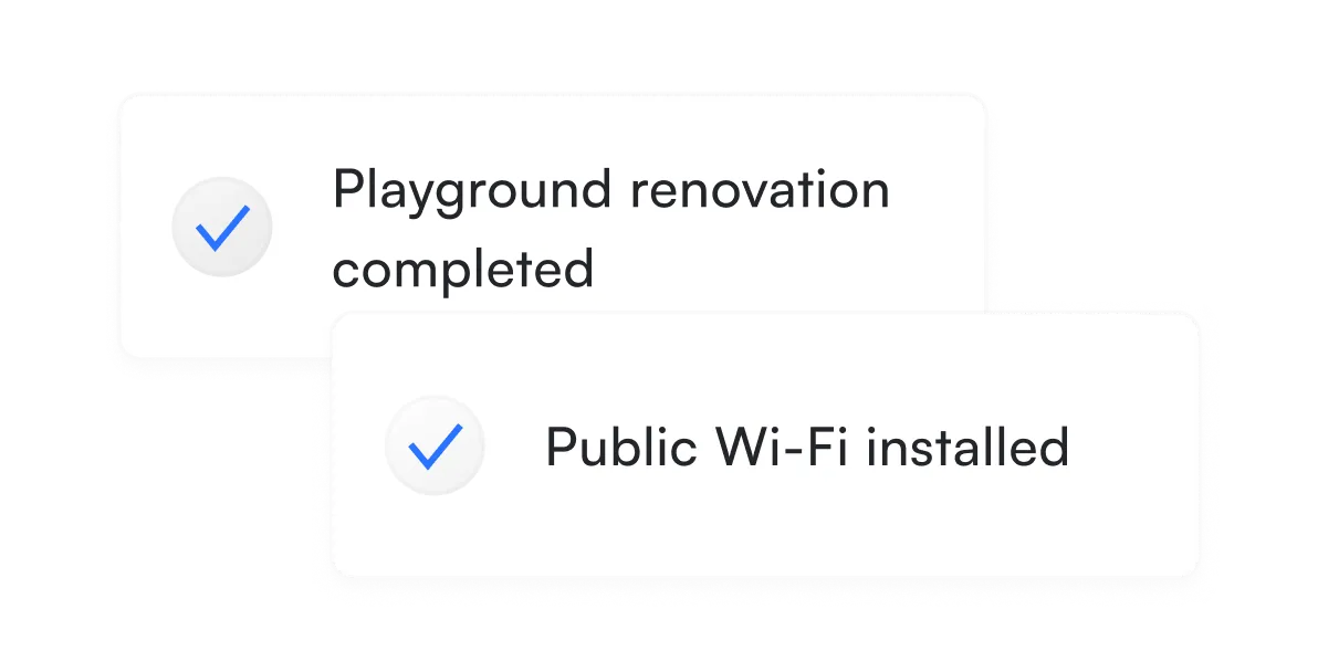 Two completed task notifications - Two white notification cards stacked vertically, each with a checkmark icon. The top card reads "Playground renovation completed" and the bottom reads "Public Wi-Fi installed." 