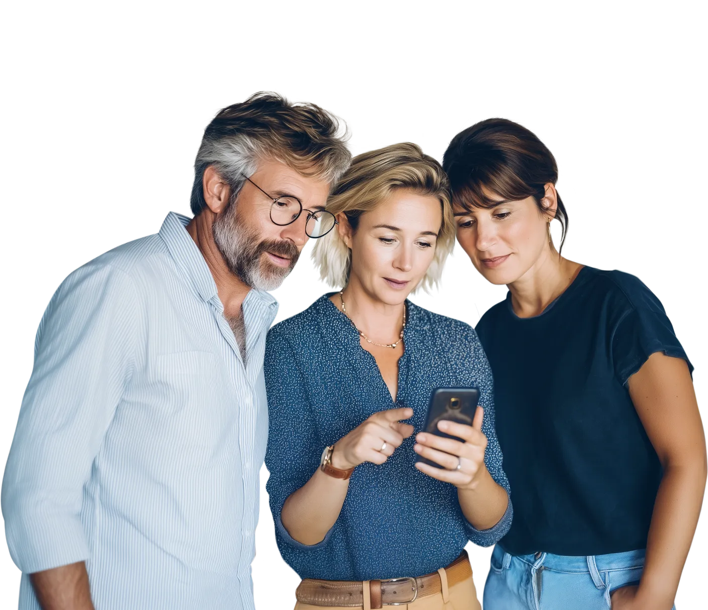 Three people looking at a smartphone together - Three people—a man in a white shirt, a woman in a denim shirt, and another person in a dark shirt—stand close together, smiling as they look at a smartphone held by the woman in the center.