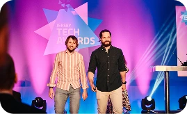 Two men posing at the Jersey Tech Awards on stage