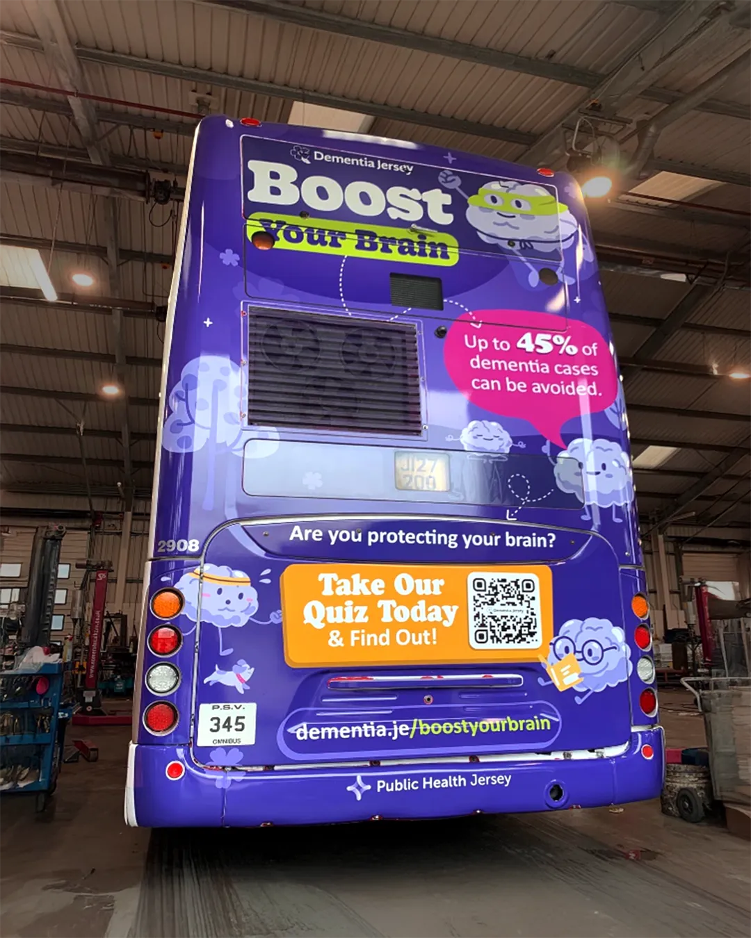 Back of a purple bus with a Dementia Jersey advert encouraging brain health and a quiz to learn more.